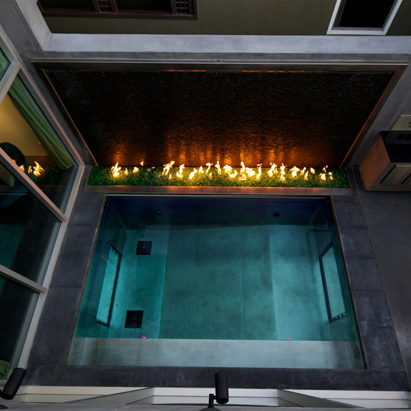 stainless steel mini pool with transparent windows, in a project by David Hertz Architects FAIA