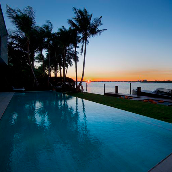 infinity transparent pool at sunset by Oppenheim Architecture
