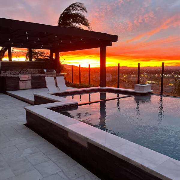 geometric above ground pool and spa at sunset by G.O. Construction