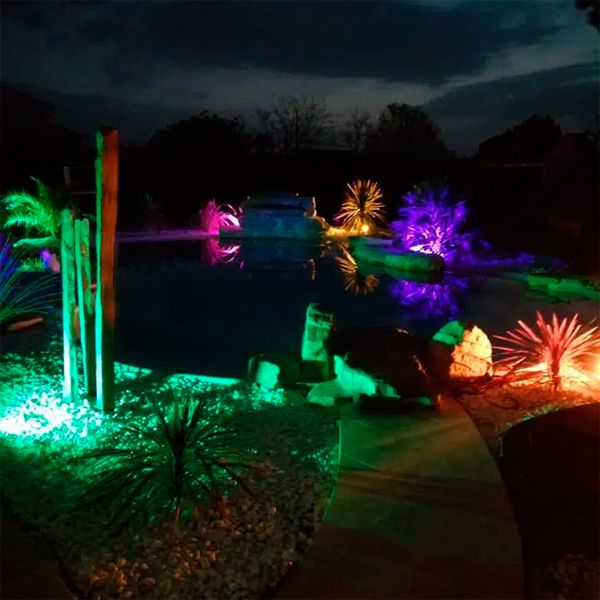 Custom lagoon pool in a private garden, by Piscines HDP
