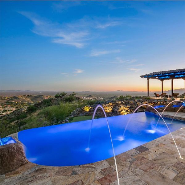 custom infinity pool, by Morris Pools, at sunset