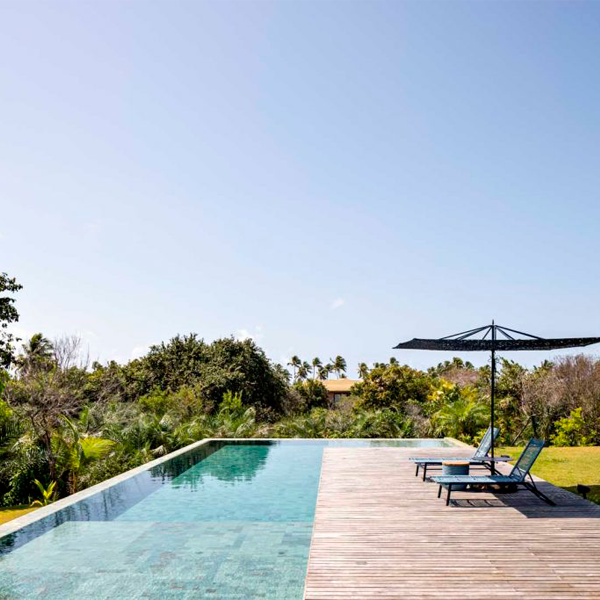 infinity pool with hijau-sukabumi stone coating, in a project by ARC+CO