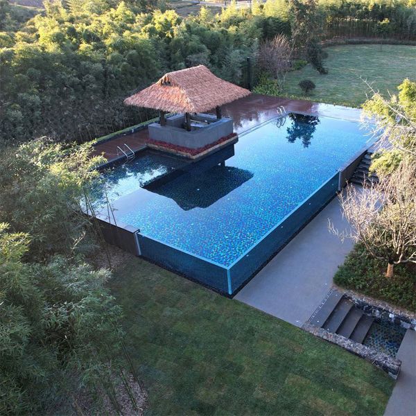 drone view of a transparent infinity pool, by Aupool