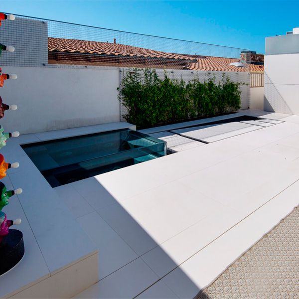 Movable floor and transparent spa in a custom pool by Mission Pools