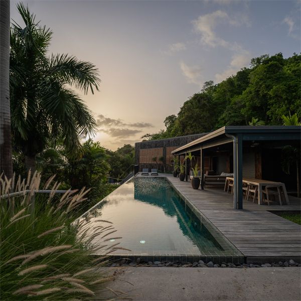 infinity lap pool at sunset in a project by Green Concept