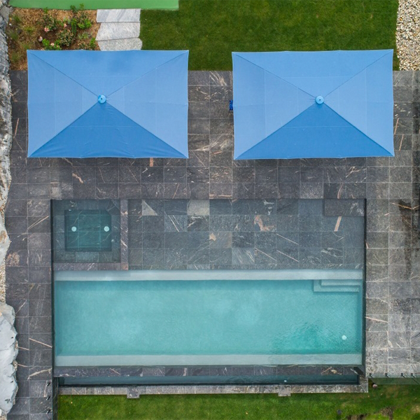drone view of an infinity pool and spa by Muskoka Pool Co