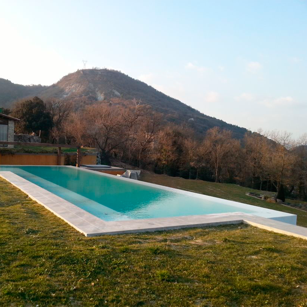 white infinity pool in the middle of the mountains