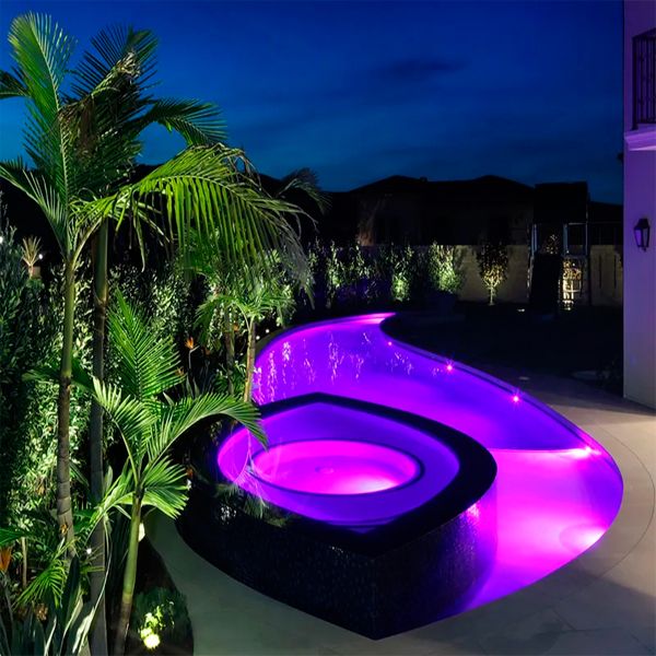 a unique pool eye shaped at night, by Danny Wang Design