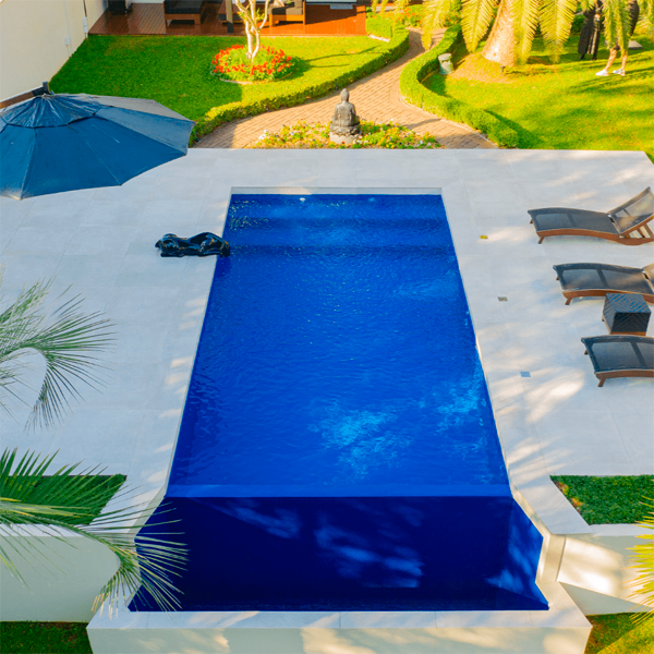 deep blue infinity pool by Unique Piscines