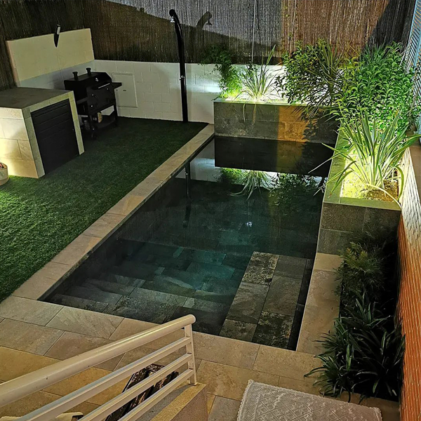 mini pool with porcelain stoware coating, at night, by Aquazzaro Piscinas