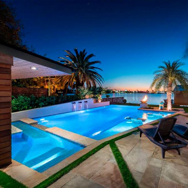infinity pool and spa at night, by Tipton Spires Design