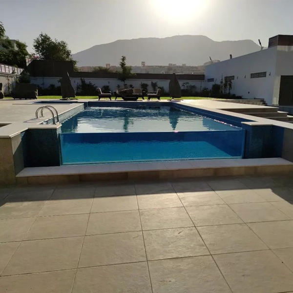 transparent infinity pool by Alpha Pools Oman