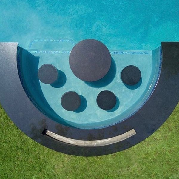 water seats in a private pool by SJ Pools and Landscaping