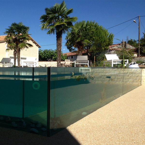 transparent and unique pool by Piscines et Concept