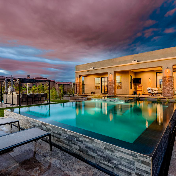 infinity pool and spa at sunset by Botanist of the Valley