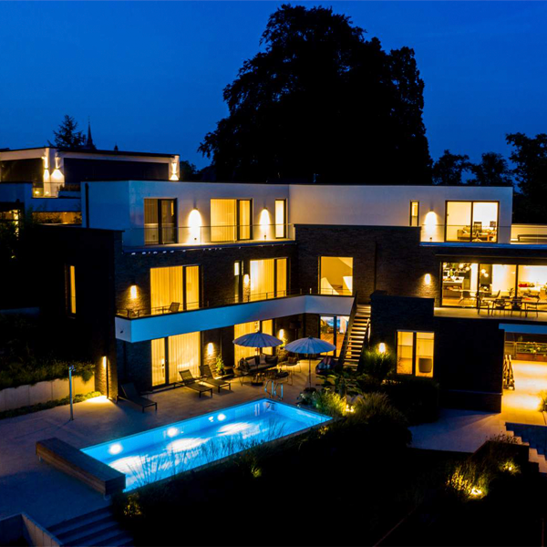 private pool with pool cover at night by Koeppen Pool