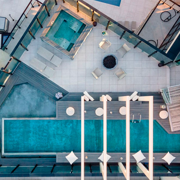 drone view of a stainless steel infinity lap pool, by Diamond Spas