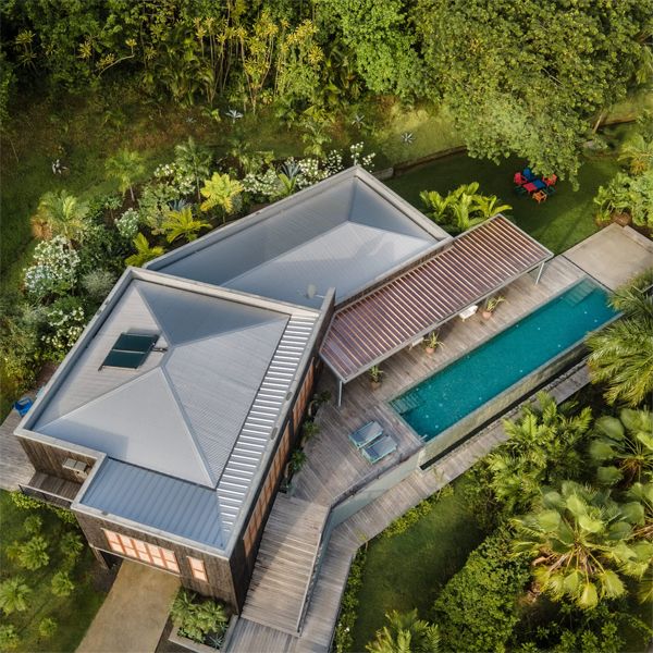 drone view of an infinity lap pool at sunset in a project by Green Concept
