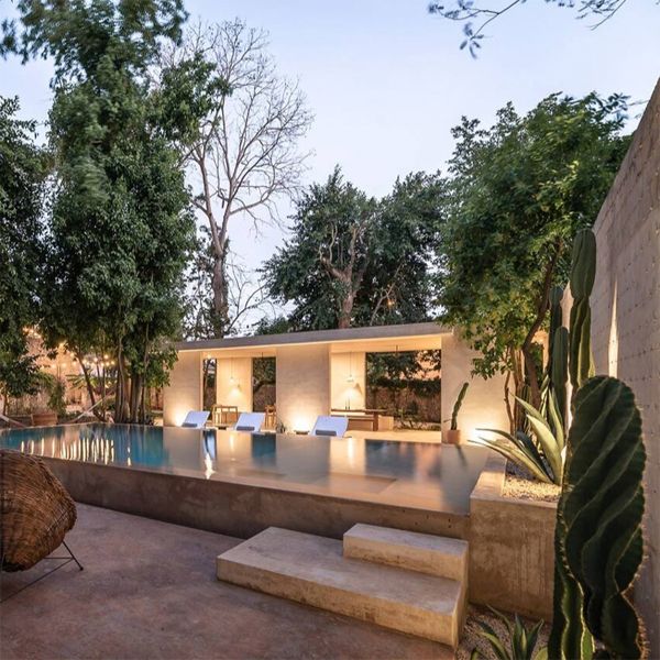 elegant infinity pool at night, in a chic boutique hotel project by Collectif Como