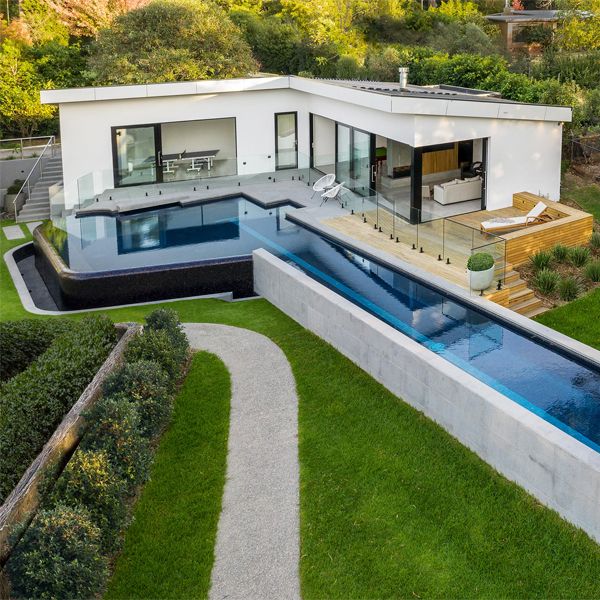 a unique infinity lap pool with spa by Laguna Pools
