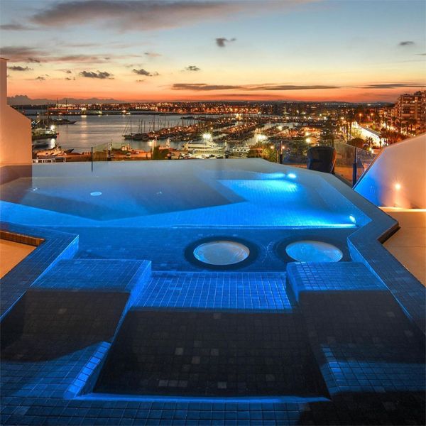 mini infinity pool spa, at sunset, by Gunitec Pools