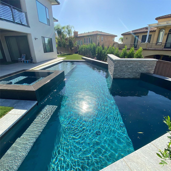 private geometric pool with raised spa by Progressive Landscapes