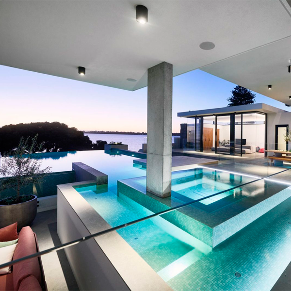 custom infinity pool and spa by Blue Stone Pools in a modern project by Averna Homes