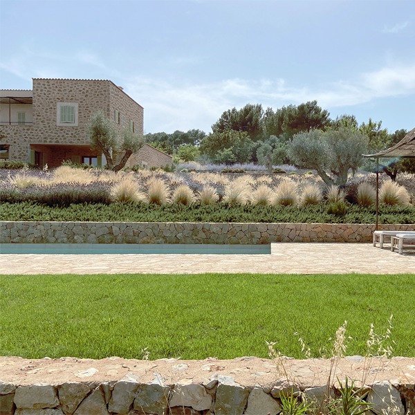 private pool in a rustic setting by Jorge Bibiloni Studio