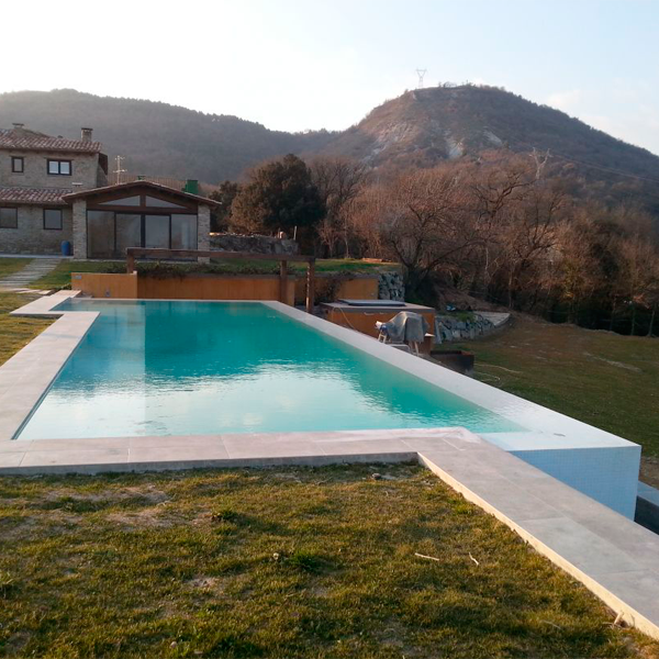 white infinity pool in the middle of the mountains