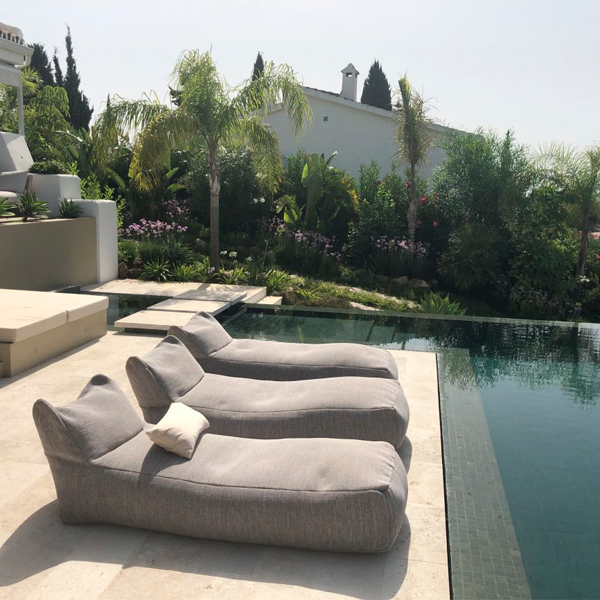 relax area in an infinity pool by Total Pool Concept