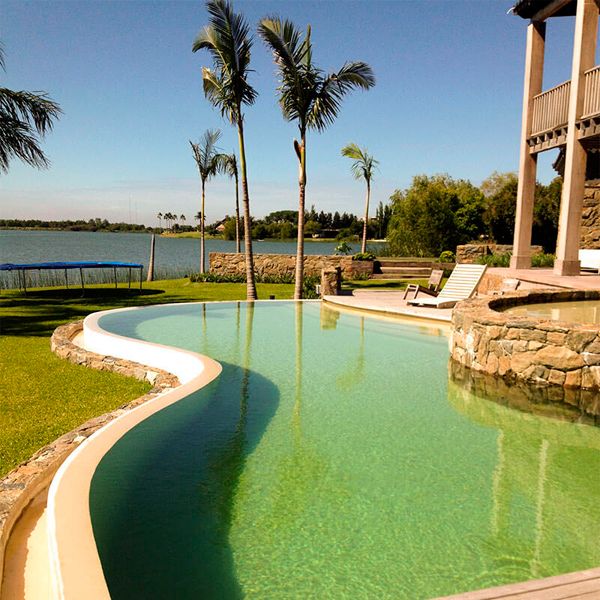 custom infinity pool with lagoon view, in a project by Ricardo Pereyra Iraola