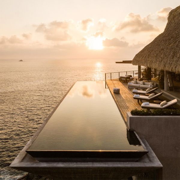 suspended infinity pool at sunset, in a project by Zozaya Arquitectos