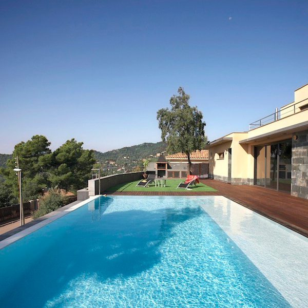 infinity pool surrounded by wood decking