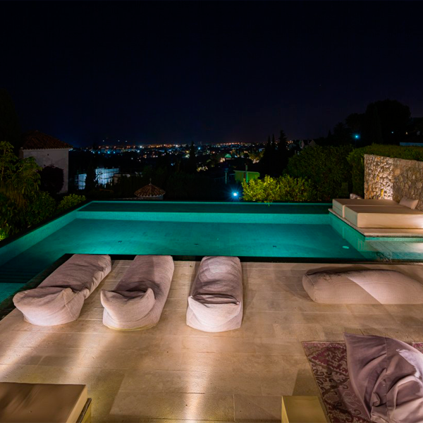 infinity pool at night by Total Pool Concept
