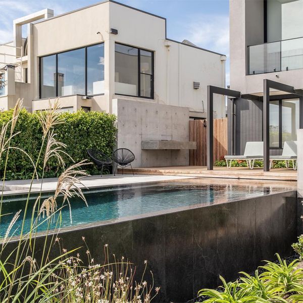 dark infinity pool and spa, by Coastal Pools and Spas