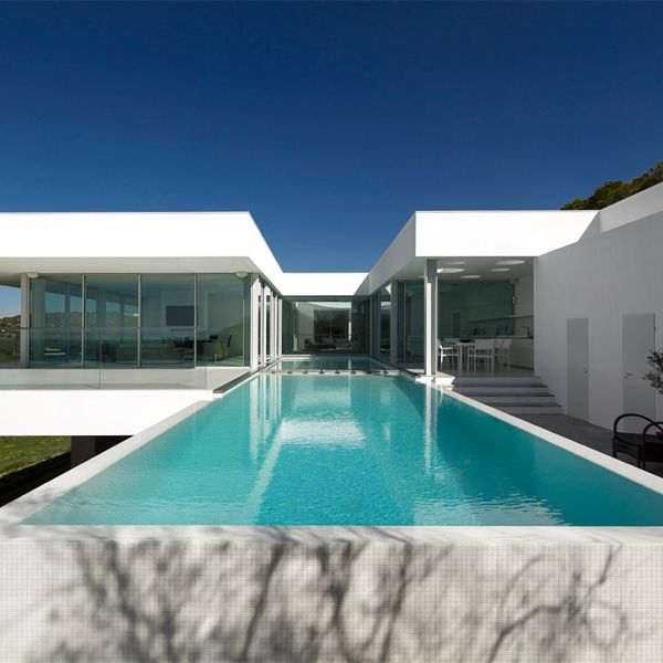 white infinity lap pool in a project by Mario Martins Atelier