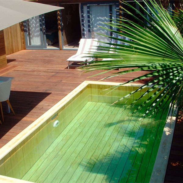 wood pool and wooden deck by Odyssea Piscines