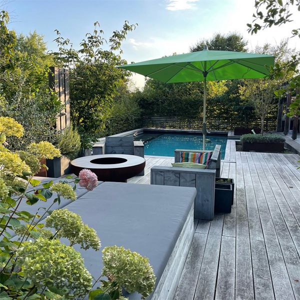 custom natural pool and wooden deck, by Messner Gaerten