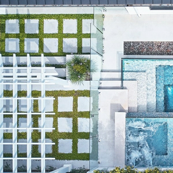 drone view of a transparent swimming pool with spa