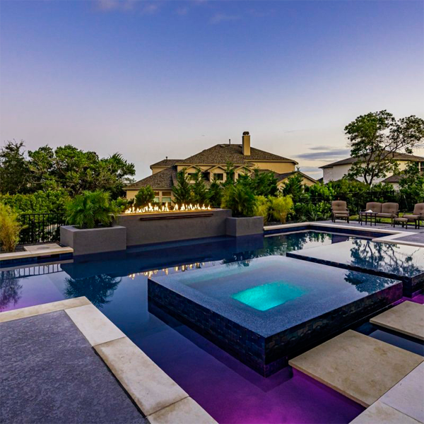 bespoke pool and spa at sunset by KB Custom Pools