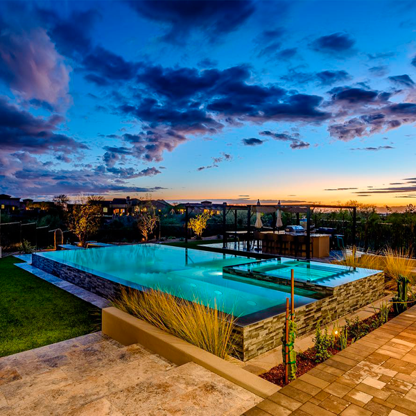 infinity pool and spa at sunset by Botanist of the Valley