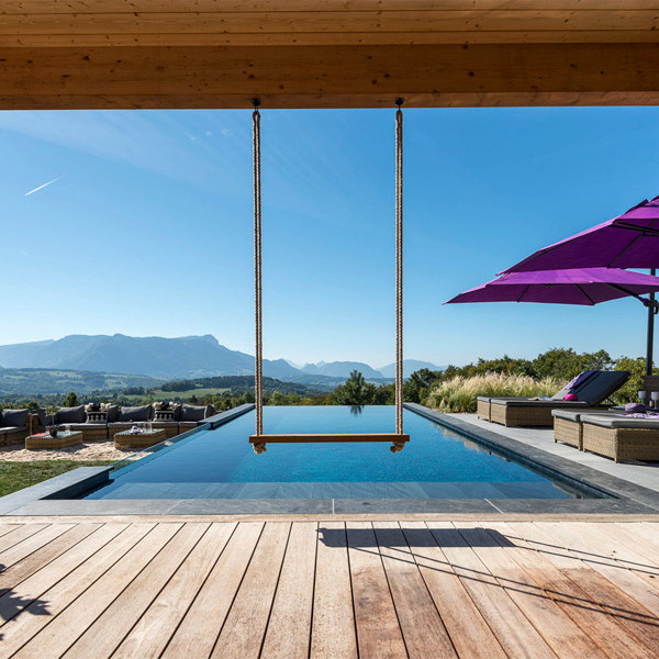 infinity pool with transparent window by Atelier Olea