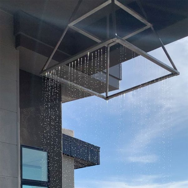 lamp shaped water feature, rain effect over a custom mini pool by Cutting Edge Pools