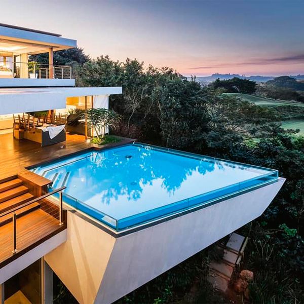 unique suspended pool at sunset, in a project by Map Architects in South Africa