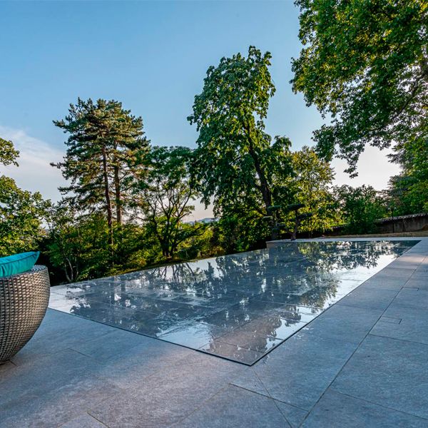 stylish infinity pool with mobile floor, by Côté Jardin