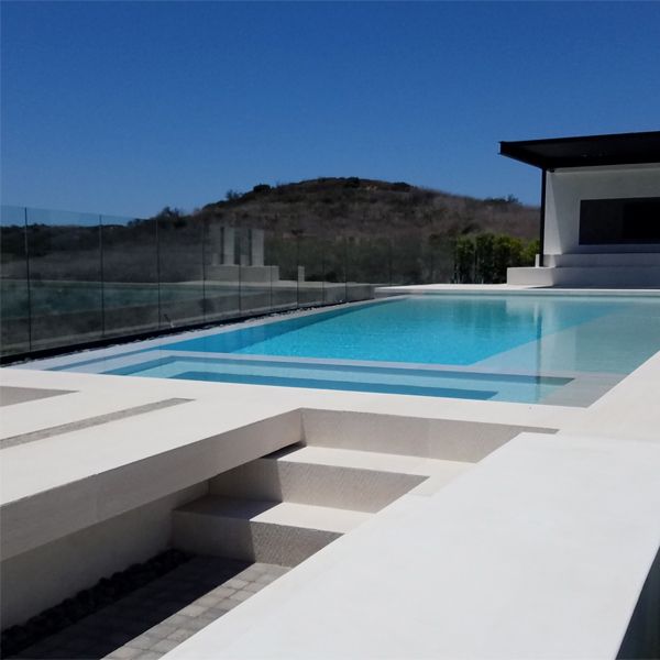 white infinity pool with built-in spa, by Monaco Luxury Pools