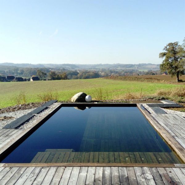 wood natural pool in a large garden, by Biopooltech