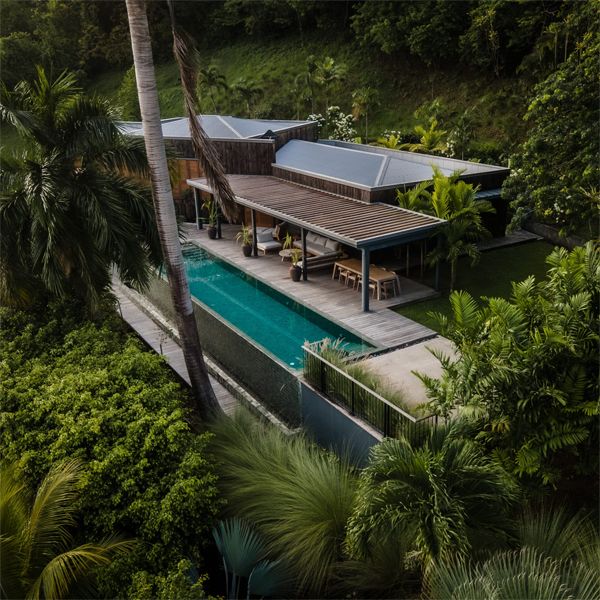 drone viev of an infinity lap pool at sunset in a project by Green Concept