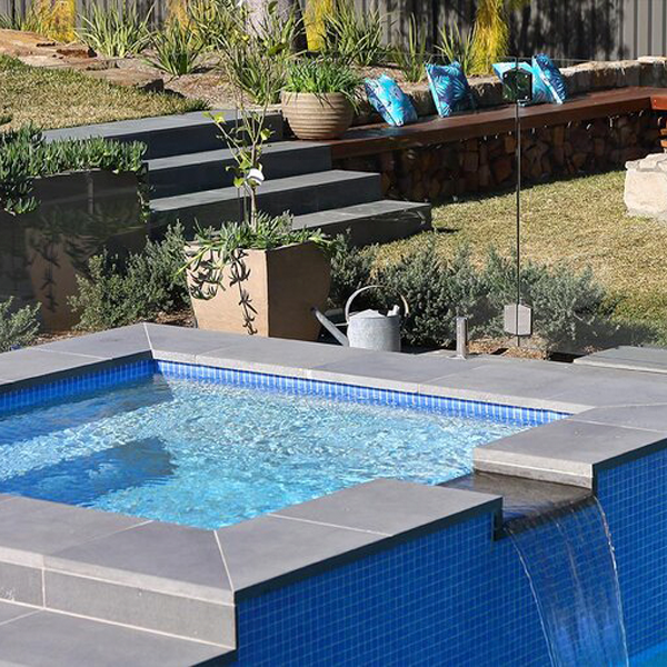 spa overflowing the pool by Outside Indulgence