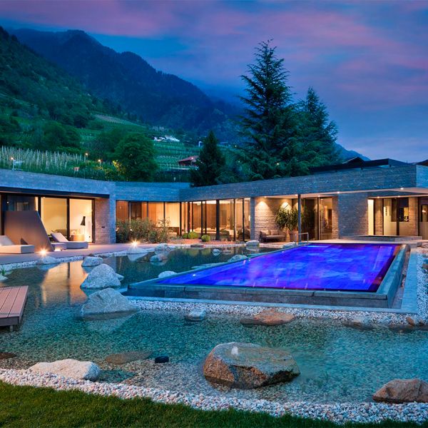 Infinity pool on a natural area, by Winkler Schwimmbad, at night